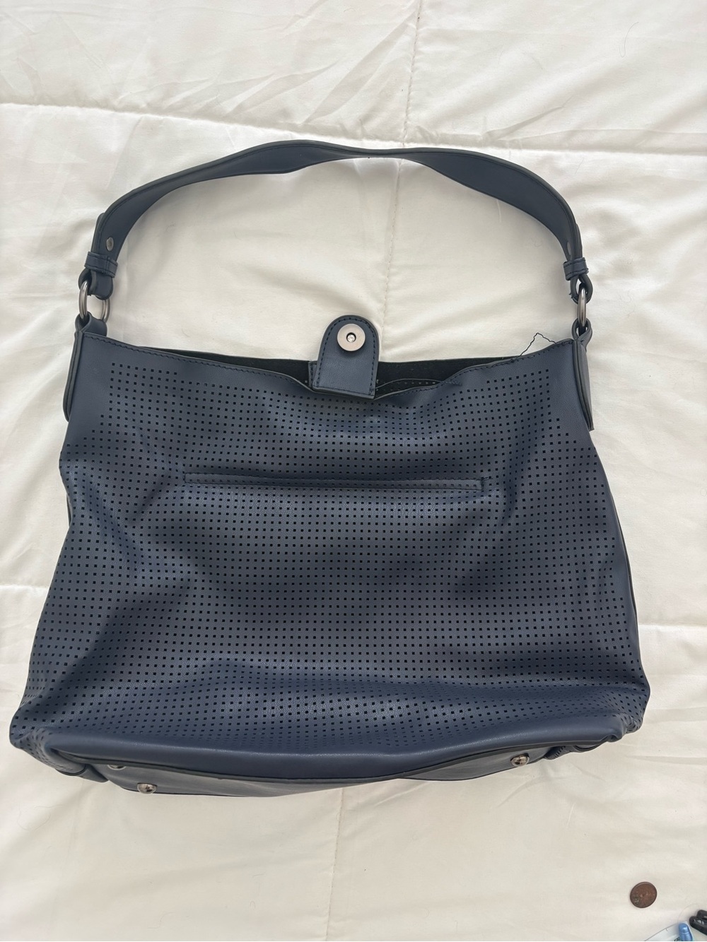 Perforated Navy Shoulder Bag with Snap Closure